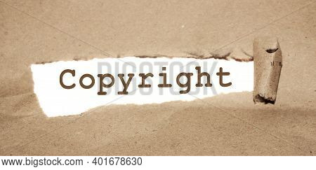 Copyright Word Uner Torn Paper. Legal Marking Of The Brand, Business Concept