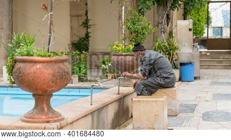 Shiraz, Iran - May 2019: Muslim Man Taking Ablution Before The Upcoming Prayer. It Is A Requirement 