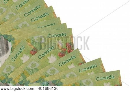 20 Canadian Dollars Bills Lies Isolated On White Background With Copy Space Stacked In Fan Close Up.