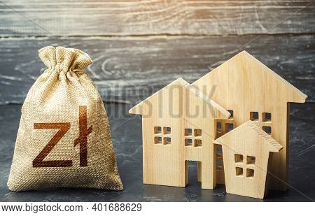 Polish Zloty Money Bag And Figurines Of Residential Buildings. Municipal Budgeting. Property Tax. In