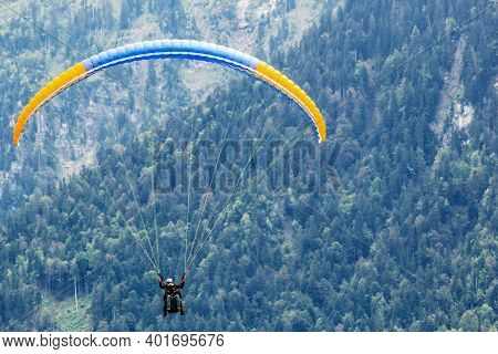 Interlaken, Switzerland - June 5, 2016: Paragliders In Interlaken, Switzerland In Interlaken, Switze