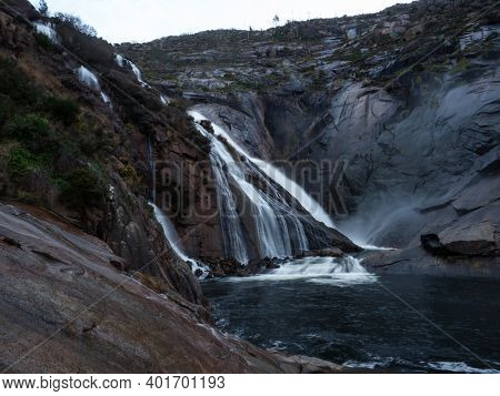 Long Exposure Of Cascada De Ezaro Waterfall Xallas Jallas River Flowing Down Rock In Dumbria La Coru