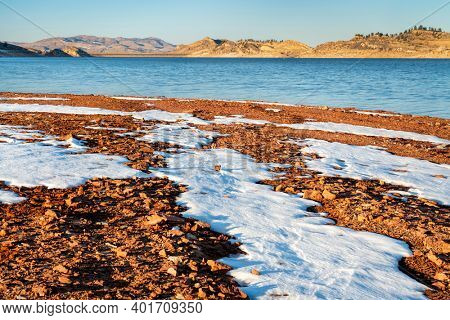winter scenery of mountain lake at foothills of Rocky Mountains in afternoon light, Horsetooth Reservoir - a popular recreational area in northern Colorado