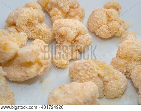 Pile Of Raw Breaded Cauliflower Top View Closeup