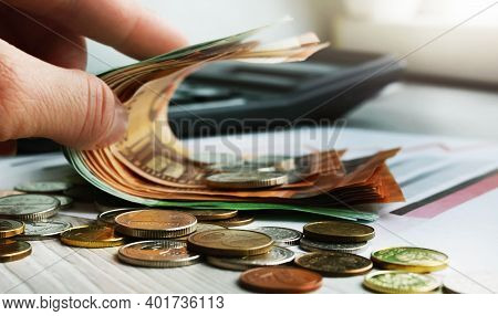 Man Holding A Stack Of American Dollar Bills. Detail Of A Macro Shot. Money Market, Finance, Currenc