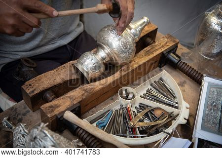 Unrecognized Professional Jewellery Maker Working In Workshop Crafting Silver Vase. Creative People 