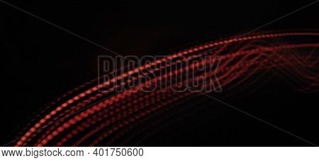 Neon Red Light Wave Pattern Abstract Isolated And Flowing Through The Black Background