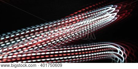 Neon Red Light Wave Pattern Abstract Isolated And Flowing Through The Black Background