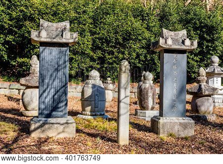 Jeongeup-si, South Korea; December 8, 2020: Closeup Of Two Memorial Steles And Buddhist Urns In Gard