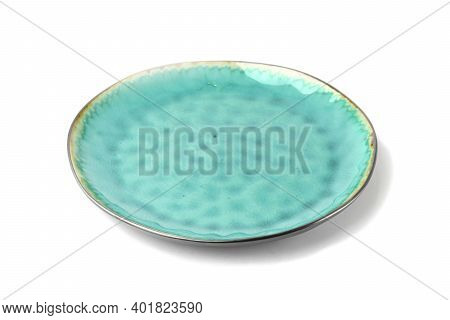 Empty Ceramic Plate Of Delicate Bed Aquamarine Turquoise Color With A Gold Border Isolated On A Whit