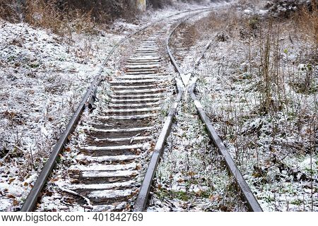 Railway Tracks For Trains Covered With Snow. Winter Railroad Track