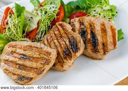 Meat With Vegetables. Pork Medallions. Grilled Meat. Cutlets Close-up. Beef.