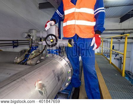 Worker Check Function Of Servo Drive On A Gate Valve On Chrome Steel Pipelines In Bio Gas Company.