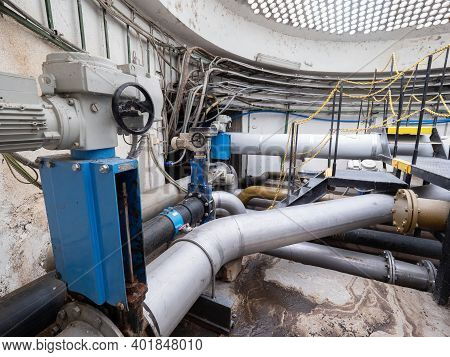 Knife Gate Valve Remotely Controlled By Servo Drive Engine In Sludge Pipe. Underground Control Shaft