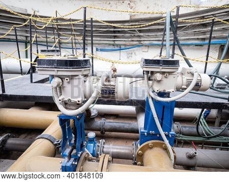 Two Knife Gate Valves On Yellow Sludge Pipeline. System Controlled Remotely  By Servo Drive Engine. 