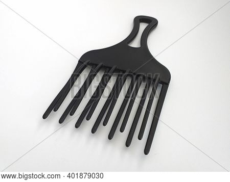 Aerial View Of Black Thick Black Afro Comb Isolated On White Background. Straightening Brush With Wi