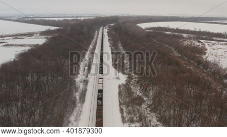 Russian Train Winter. A Train With Open Wagons Travels Through Winter Russia. A Train With Wagons Tr