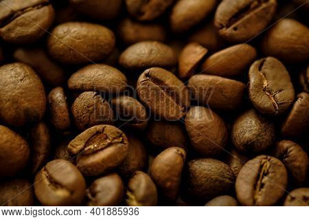 Coffee Beans Background. Fried Coffee On Grunge Wooden Background.
