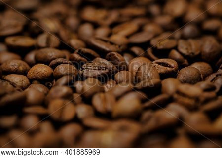 Coffee Beans Background. Fried Coffee On Grunge Wooden Background.