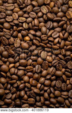 Coffee Beans Background. Fried Coffee On Grunge Wooden Background.