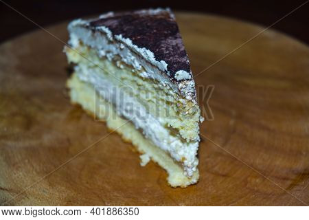 Cheese Cream Cake Served On A Wooden Dish