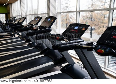 Treadmills In A Modern Gym And Fitness Center With Equipment And Exercise Machines.