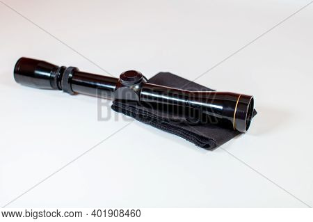 A Compact, 3x9 Magnification Scope Sits On A White Background, Ready To Be Mounted On A Rifle To Hel