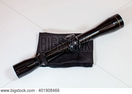 A Compact, 3x9 Magnification Scope Sits On A White Background, Ready To Be Mounted On A Rifle To Hel
