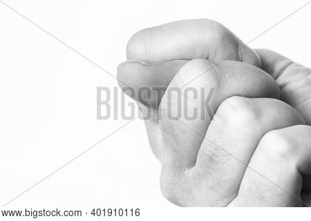 Fist With The Thumb On A White Background