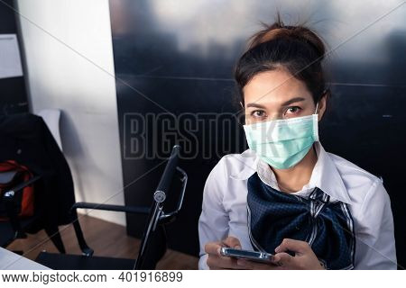 Asian Woman Saleman Wear Surgical Mask Working In Inspector Checking News Covid19 From Smartphone In