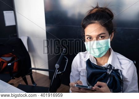 Asian Woman Saleman Wear Surgical Mask Working In Inspector Checking News Covid19 From Smartphone In