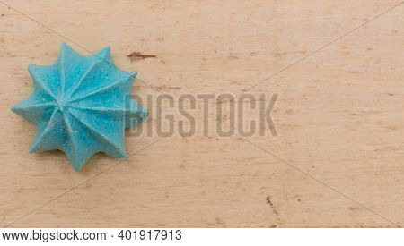 Blue, Sweet, Crispy Meringue On A Wooden Background.