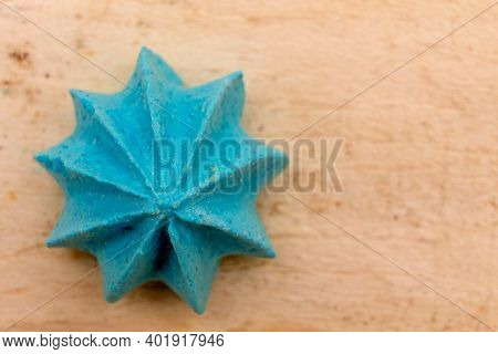 Blue, Sweet, Crispy Meringue On A Wooden Background.