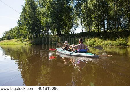 19.07.20 Kaluga, Russia. Men And Women Kayak On The River In The Summer. Active Recreation, Family T