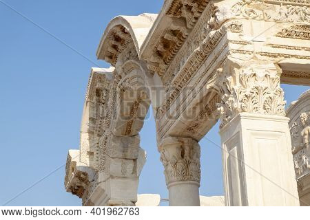 Stone Door And Human Figures Above The Door