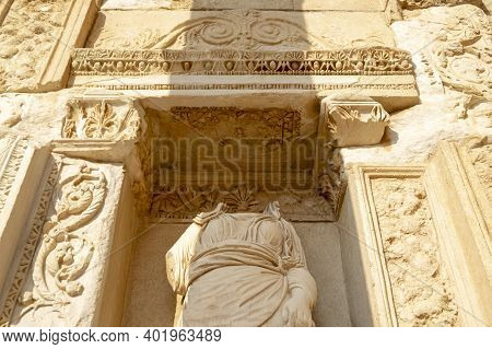 Headless Figure On Library Wall In Ephesus Ancient City