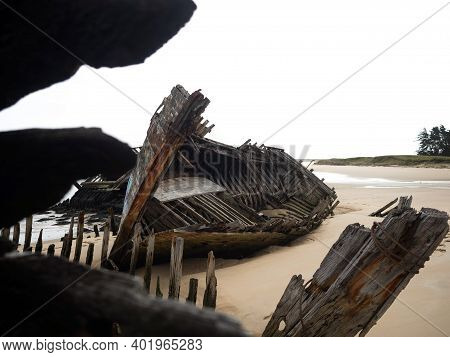 Stranded Broken Wooden Shipwrecks On Fishing Boat Naval Graveyard Marine Cemetery In Magouer Etel Ri