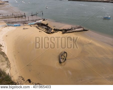 Aerial View Of Stranded Broken Wooden Shipwrecks Boat Graveyard Marine Cemetery In Magouer Etel Rive