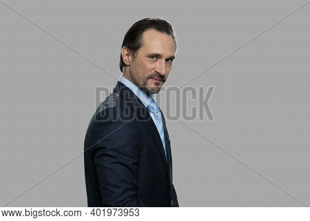 Dissatisfied Businessman Is Expressing Mistrust. Distrustful Sceptical Middle-aged Businessman Looki