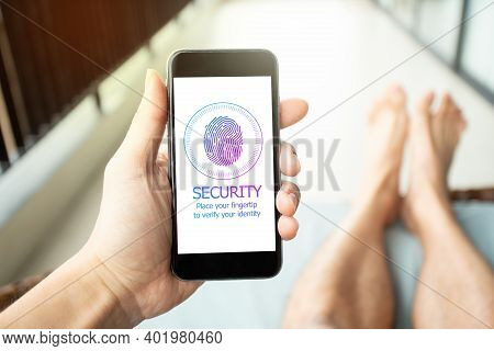People On Holiday Using Smartphone To Sign A Password By Fingertip. Mobile Security Concept.