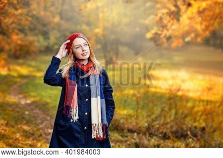 Blonde Happy Girl In Good Mood Posing In Autumn Park, Walks For A Womans Peace Of Mind