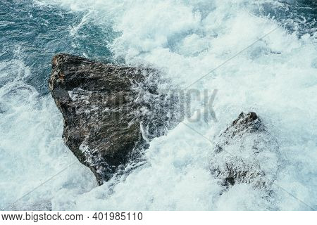 Big Stones In Azure Water Of Mountain River Close-up. Blue Nature Background With Big Boulders In Tu