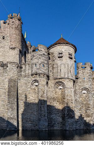 Castle Of Ghent (gand) Mirroring In The Water (belgium)