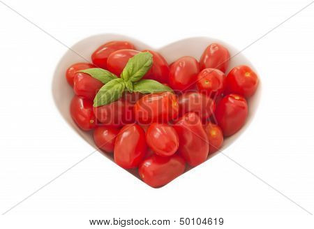 Baby Plum Tomates In A Heart Shaped Bowl
