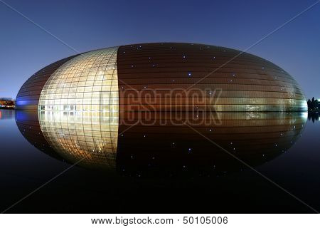 BEIJING, CHINA - APR 3: National Centre for the Performing Arts NCPA at night on April 3, 2013 in Beijing, China. Cost 2.8B CNY, it seats 5,452 people. The first performance was held in December 2007