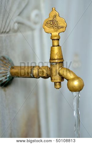 Antique Turkish faucet on wall