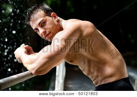 Attractive Young Bodybuilder Outdoors, Leaning