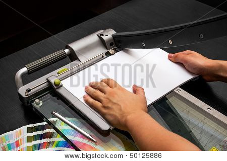 Man Working On The Guillotine For Paper