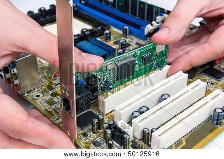 Man Installing Lan Networdk Adapter Into Pc