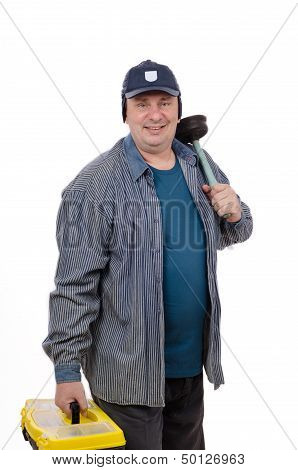Plumber at work with toolbox and plunger